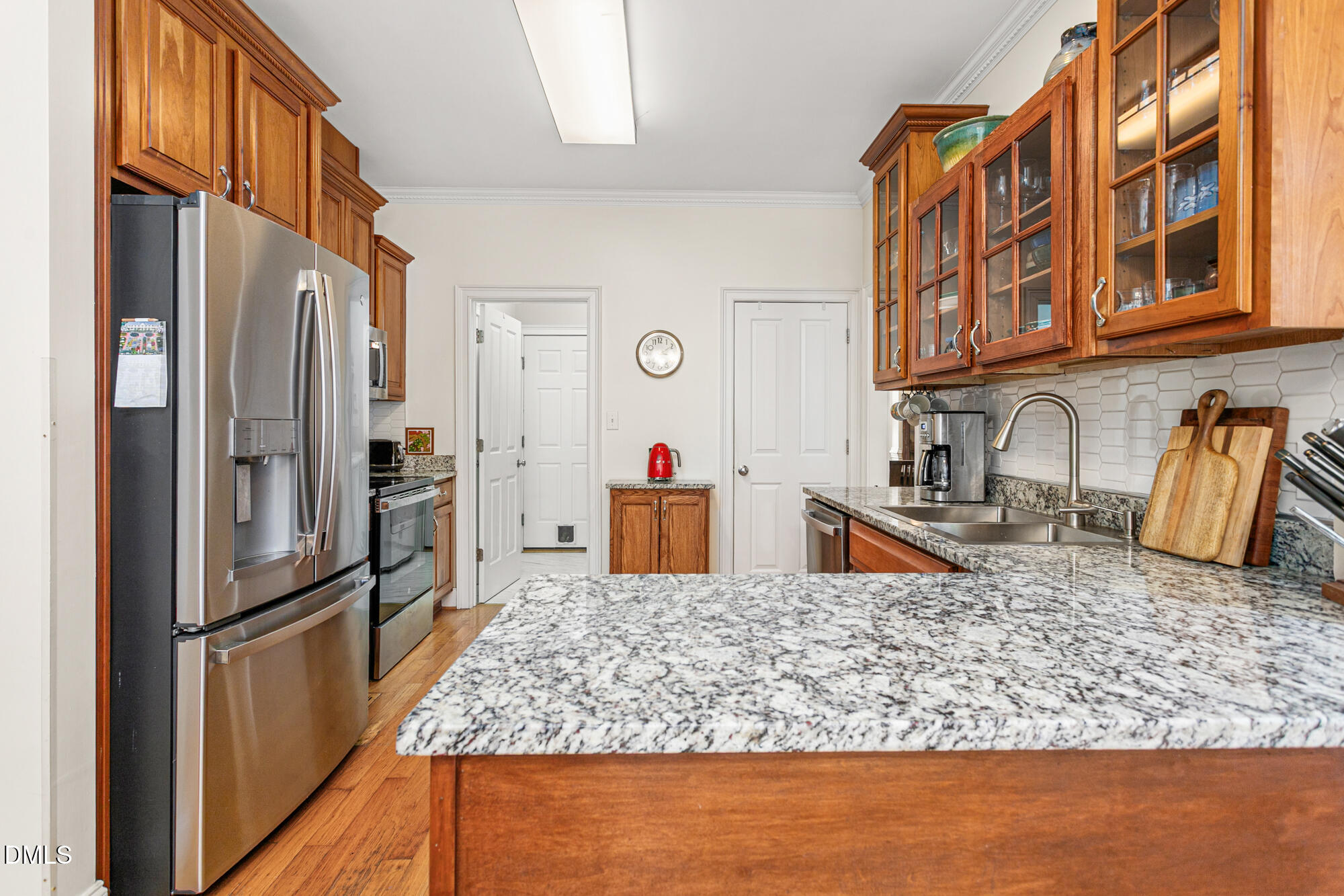 7 Powder Springs Place Durham, NC 27712 - Photo 14 of 44 a kitchen with stainless steel appliances granite countertop a refrigerator and a sink