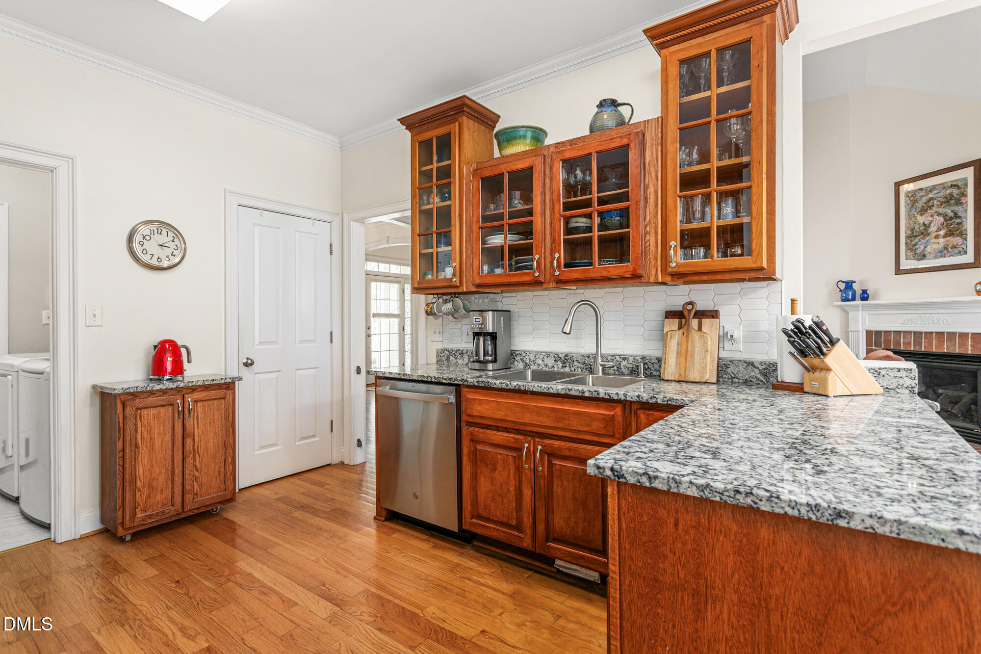 7 Powder Springs Place Durham, NC 27712 - Photo 15 of 44 a kitchen with stainless steel appliances granite countertop wooden cabinets and sink