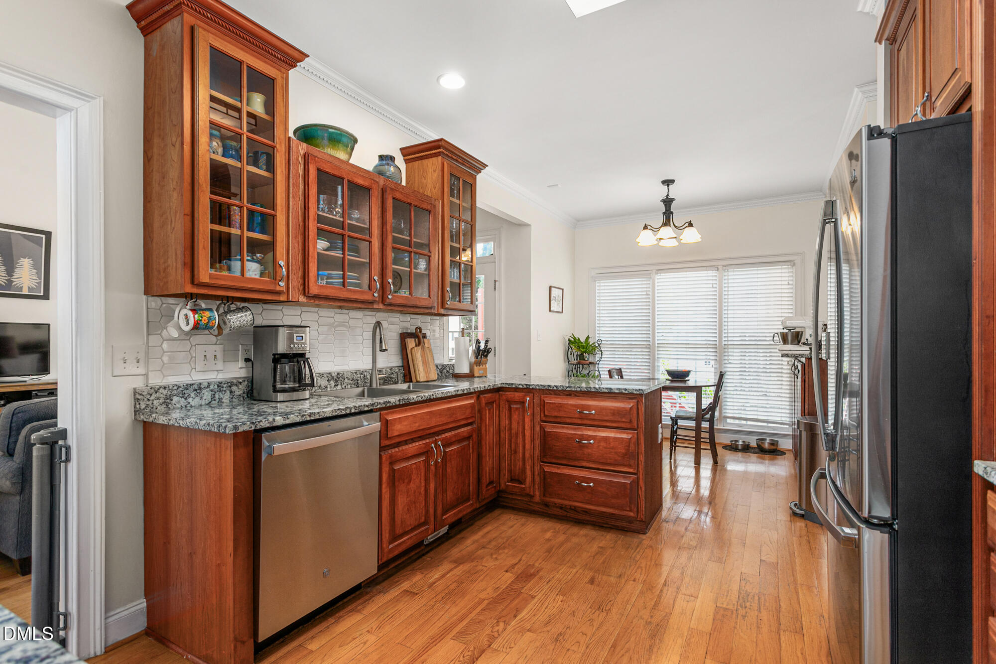 7 Powder Springs Place Durham, NC 27712 - Photo 16 of 44 a kitchen with stainless steel appliances granite countertop a stove a sink dishwasher and a refrigerator
