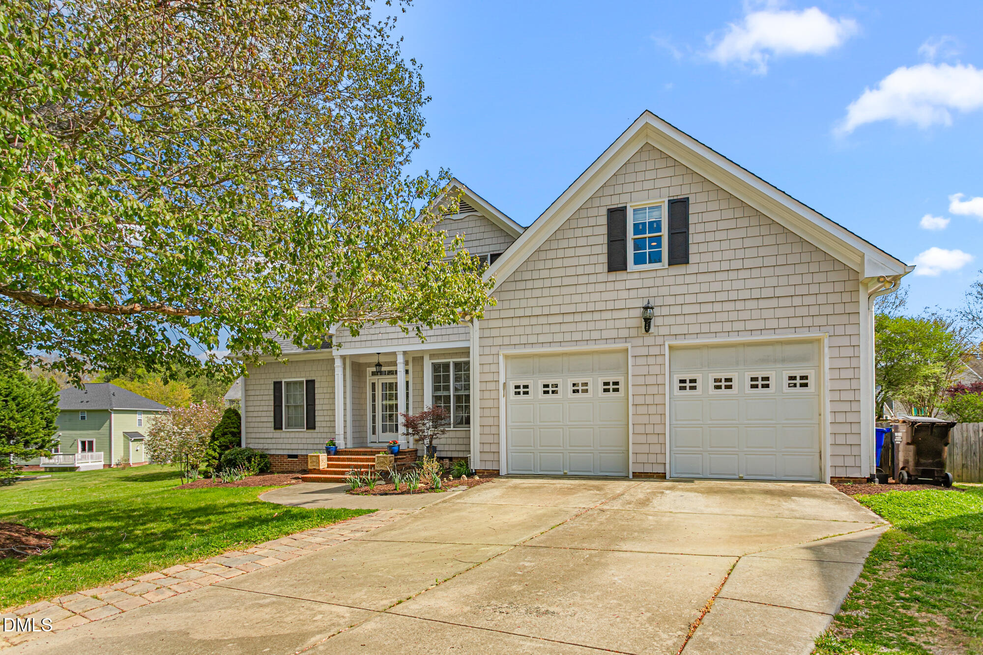 7 Powder Springs Place Durham, NC 27712 - Photo 2 of 44 a view of a house with a backyard and a garage