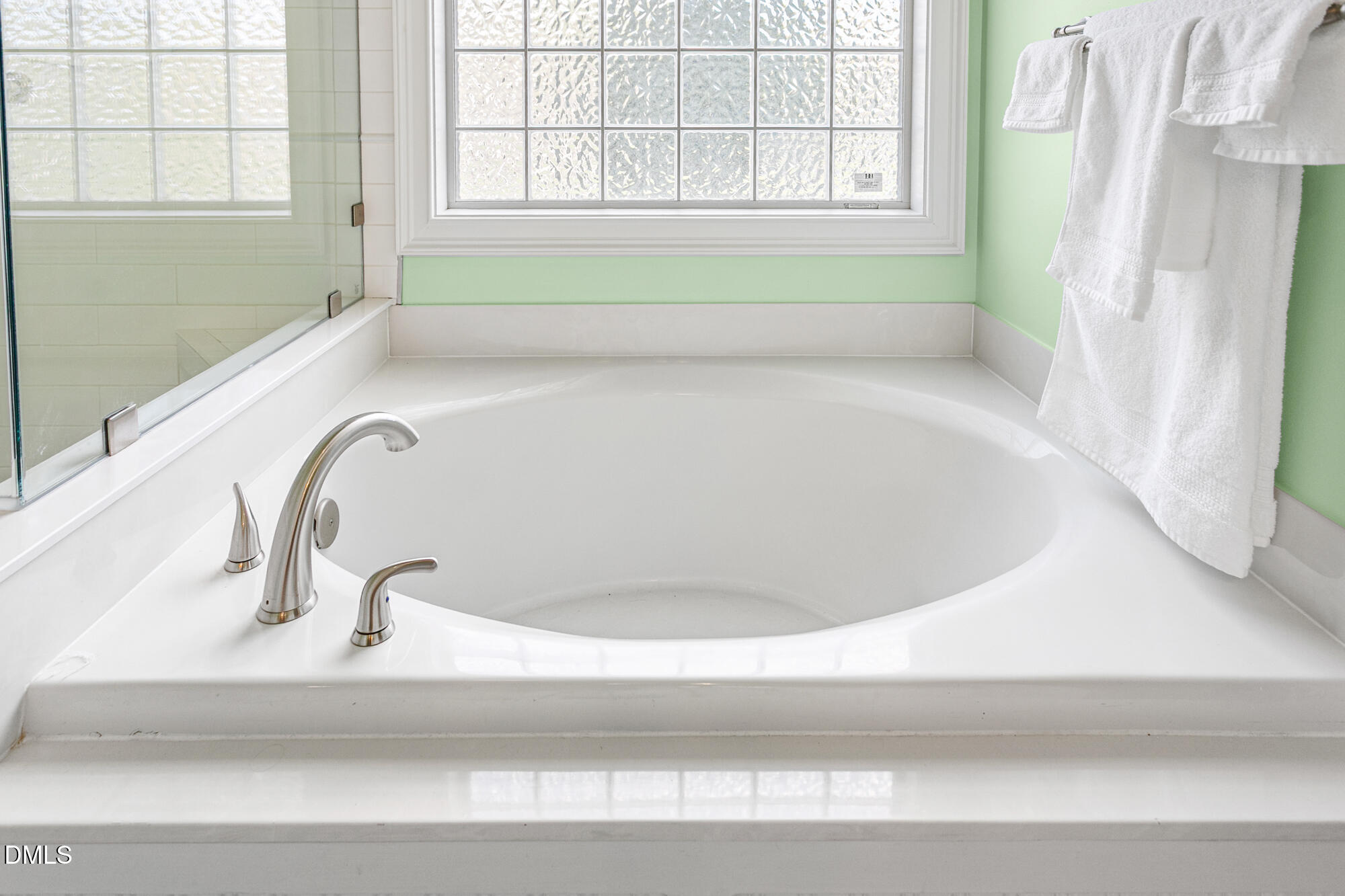 7 Powder Springs Place Durham, NC 27712 - Photo 28 of 44 a bathroom with a bathtub and window