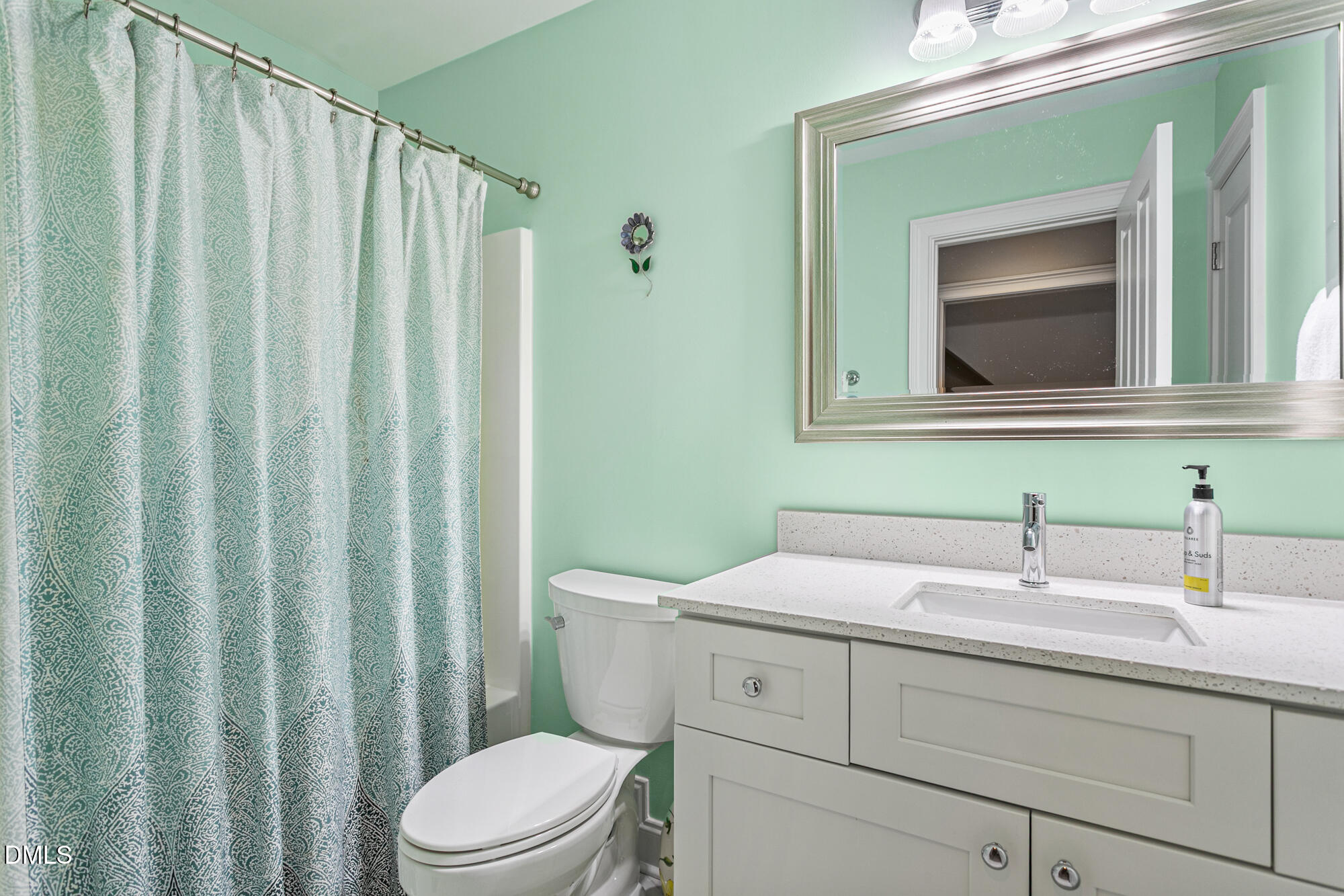7 Powder Springs Place Durham, NC 27712 - Photo 30 of 44 a bathroom with a toilet a sink and a mirror