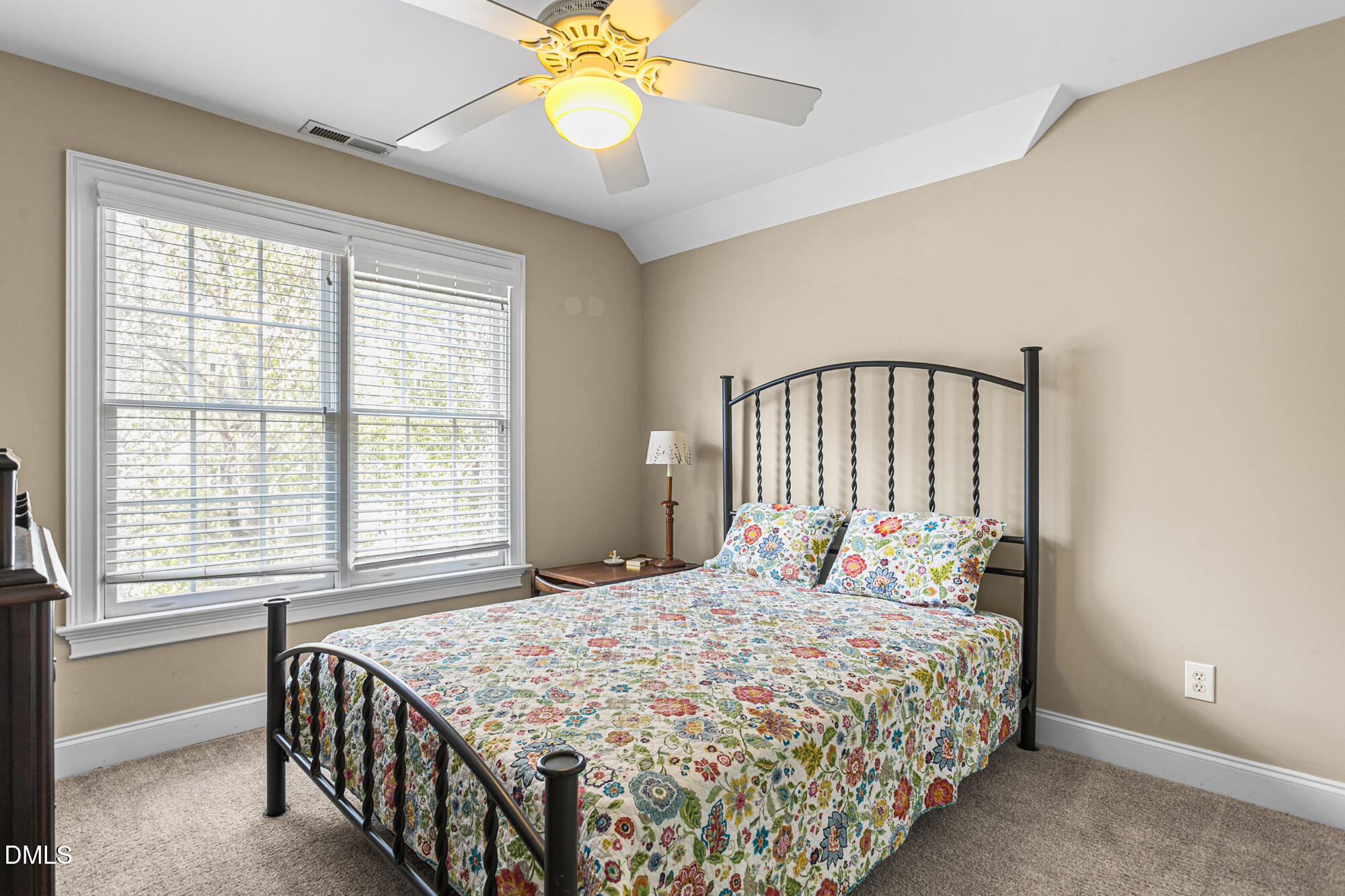 7 Powder Springs Place Durham, NC 27712 - Photo 33 of 44 a bedroom with a bed and a chandelier