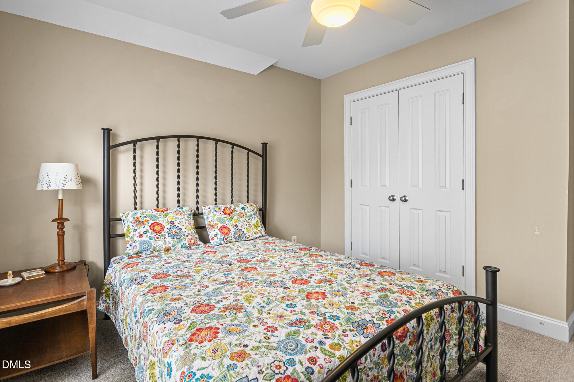 7 Powder Springs Place Durham, NC 27712 - Photo 34 of 44 a bedroom with a bed and a chandelier