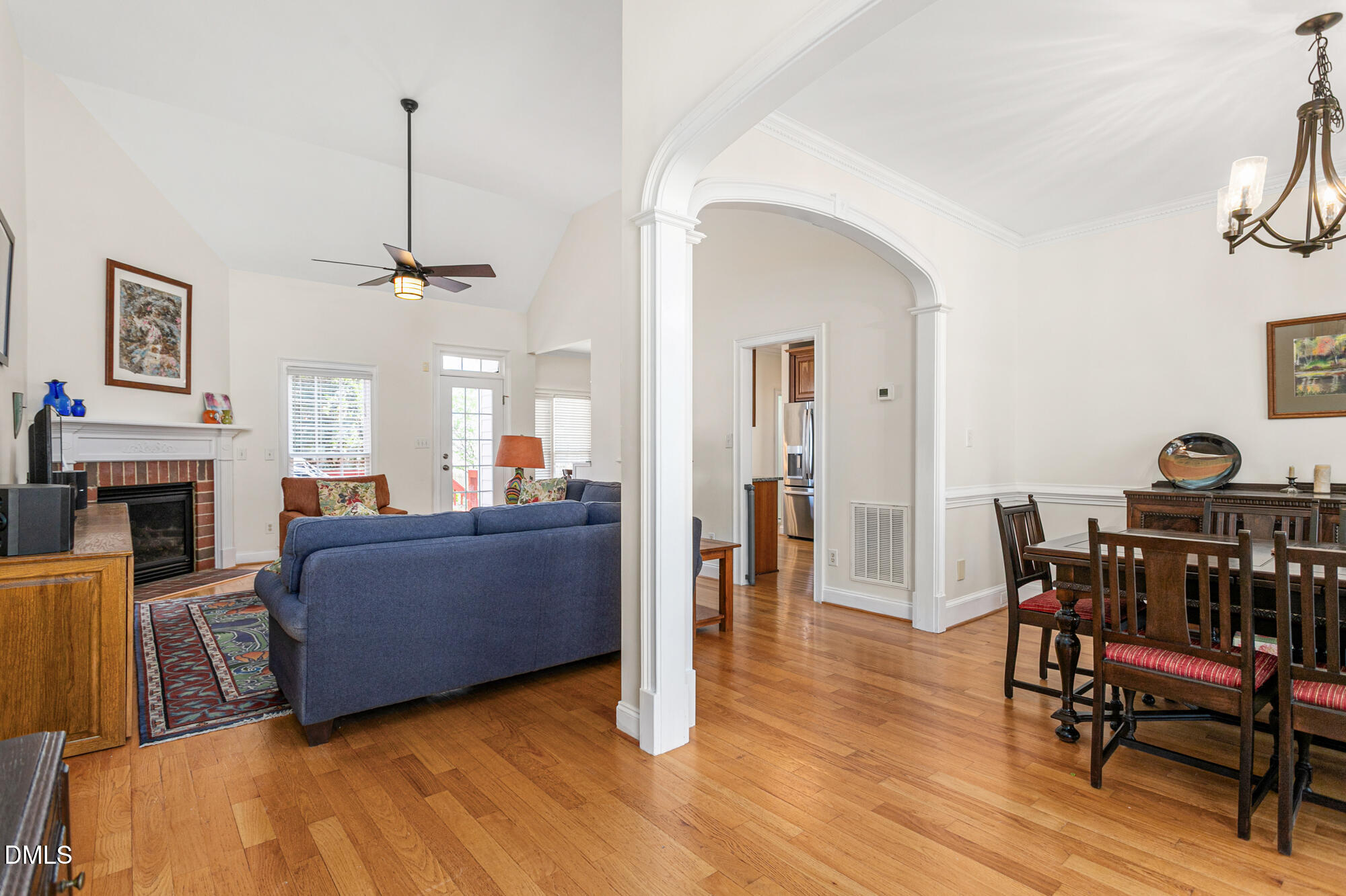 7 Powder Springs Place Durham, NC 27712 - Photo 9 of 44 a living room with furniture and a chandelier