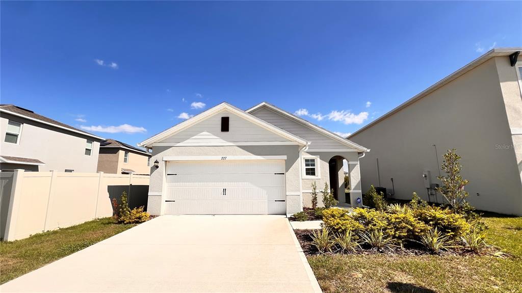 a front view of a house with a garage