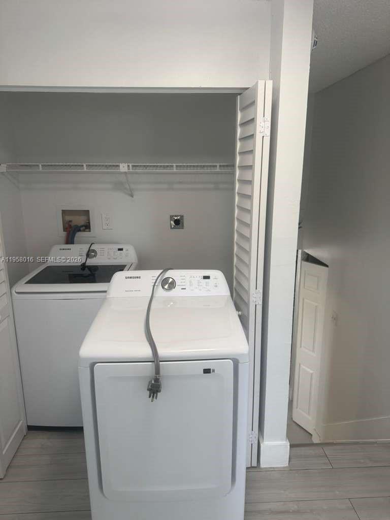 10034 Southwest 221st Street Cutler Bay, FL 33190 - Photo 13 of 25 a utility room with dryer and washer
