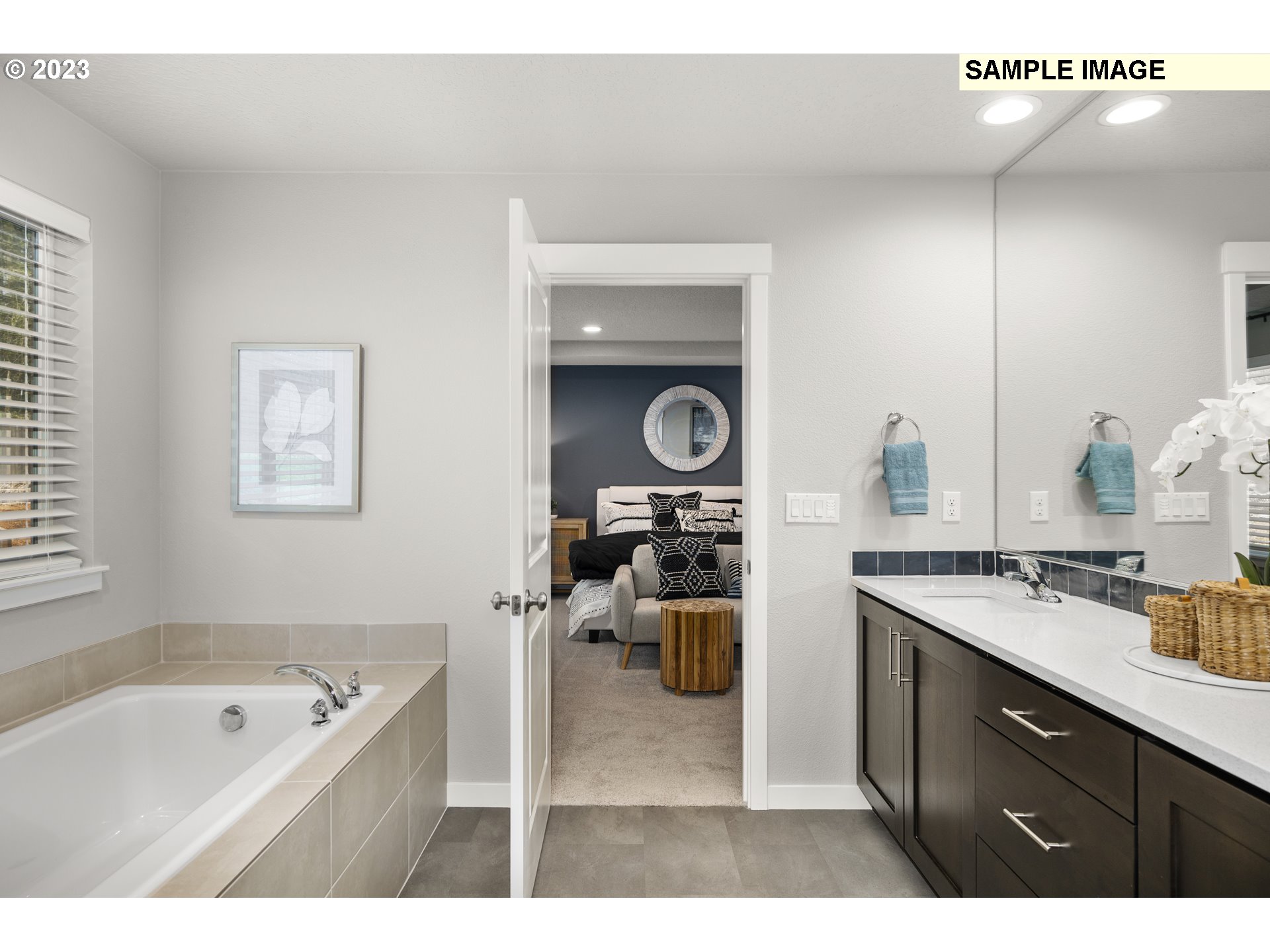 41510 Metolius Avenue, Unit 16 Sandy, OR 97055 - Photo 18 of 40 a bathroom with a sink a bathtub and a window