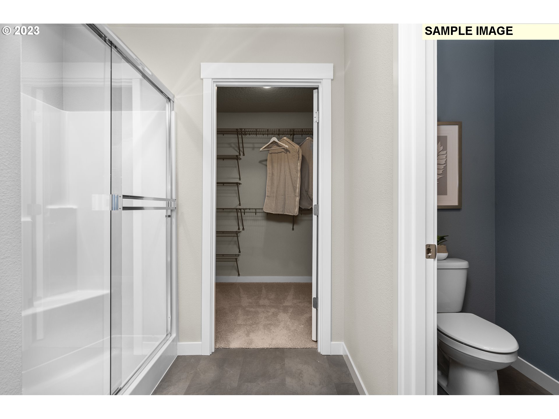 41510 Metolius Avenue, Unit 16 Sandy, OR 97055 - Photo 32 of 40 a bathroom with a granite countertop toilet and a shower