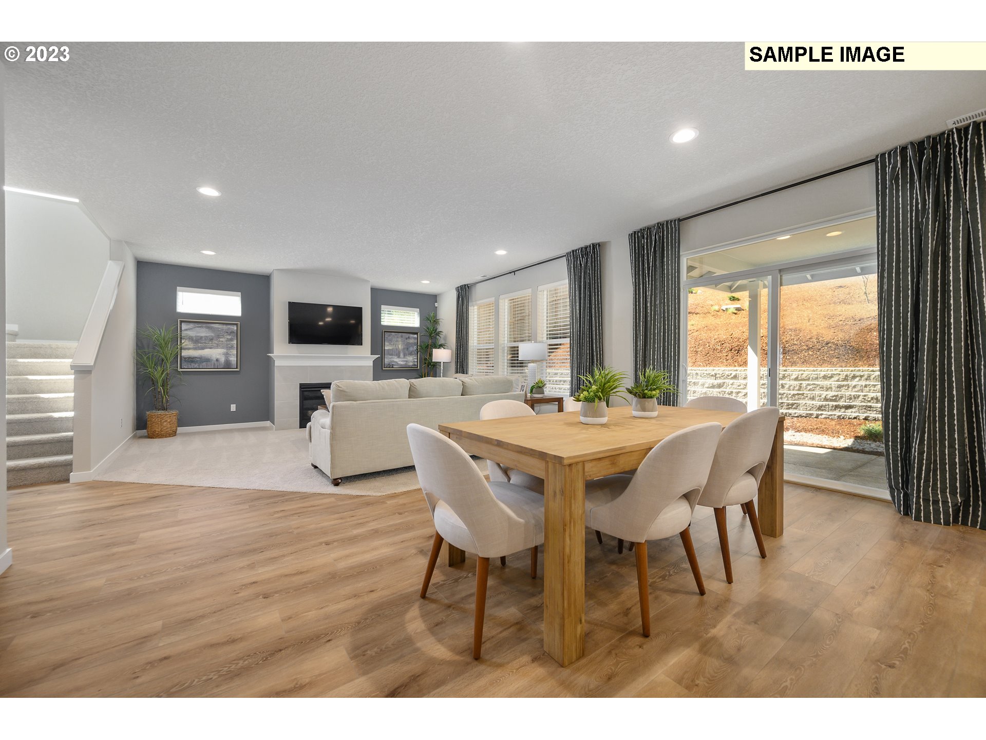41510 Metolius Avenue, Unit 16 Sandy, OR 97055 - Photo 10 of 40 a dining room with furniture a window and wooden floor