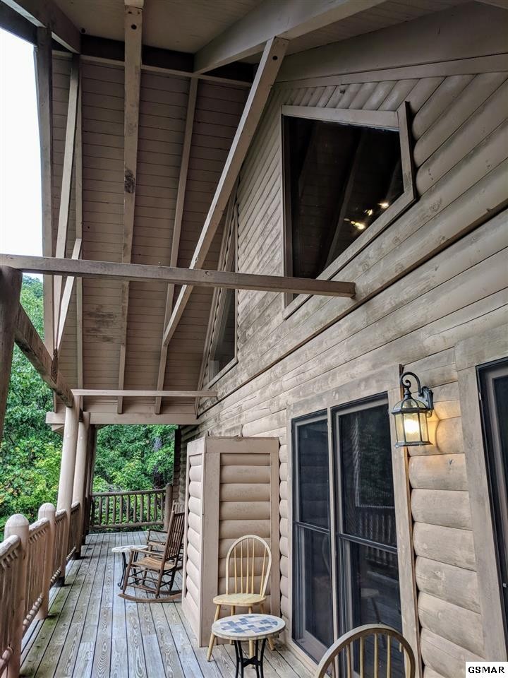 4409 Deerskin Road Sevierville, TN 37862 - Photo 20 of 31 a view of a porch with furniture and wooden floor
