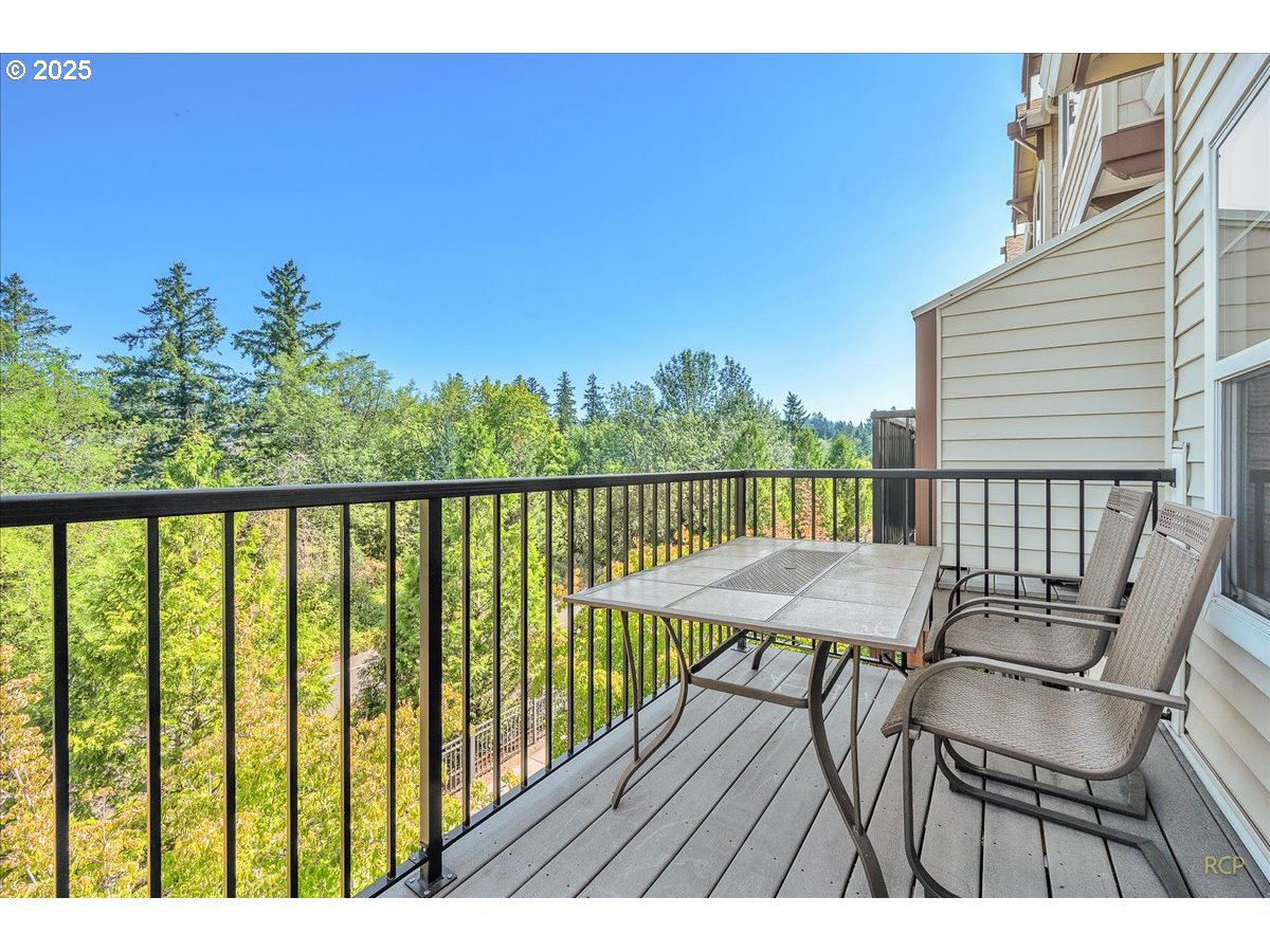 794 Northwest 118th Avenue, Unit 101 Portland, OR 97229 - Photo 19 of 41 a view of a balcony with wooden floor and outdoor seating