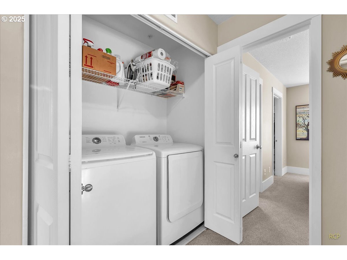794 Northwest 118th Avenue, Unit 101 Portland, OR 97229 - Photo 22 of 41 a utility room with dryer and washer