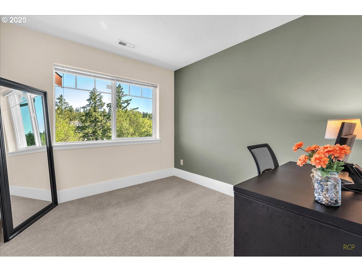 794 Northwest 118th Avenue, Unit 101 Portland, OR 97229 - Photo 31 of 41 a view of an empty room with a window