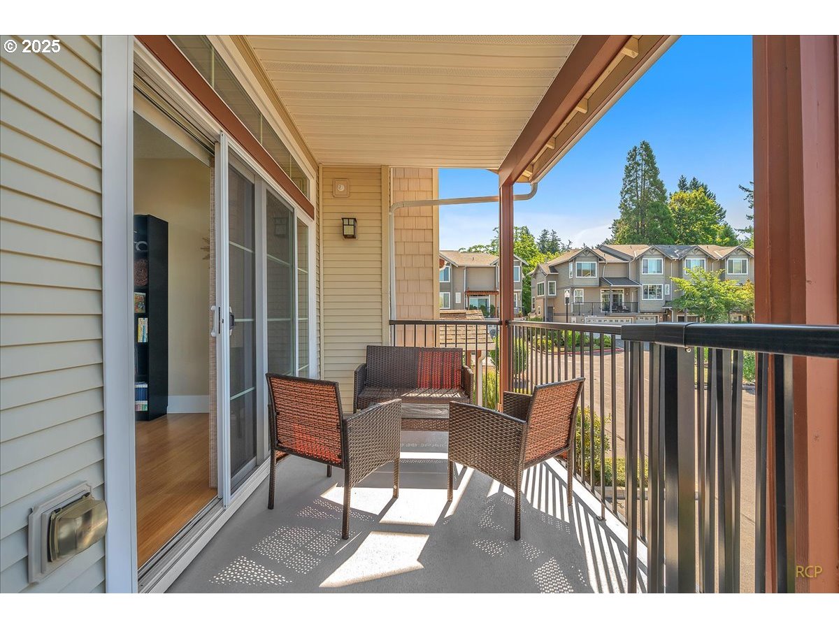 794 Northwest 118th Avenue, Unit 101 Portland, OR 97229 - Photo 9 of 41 a view of a chairs and table in the balcony