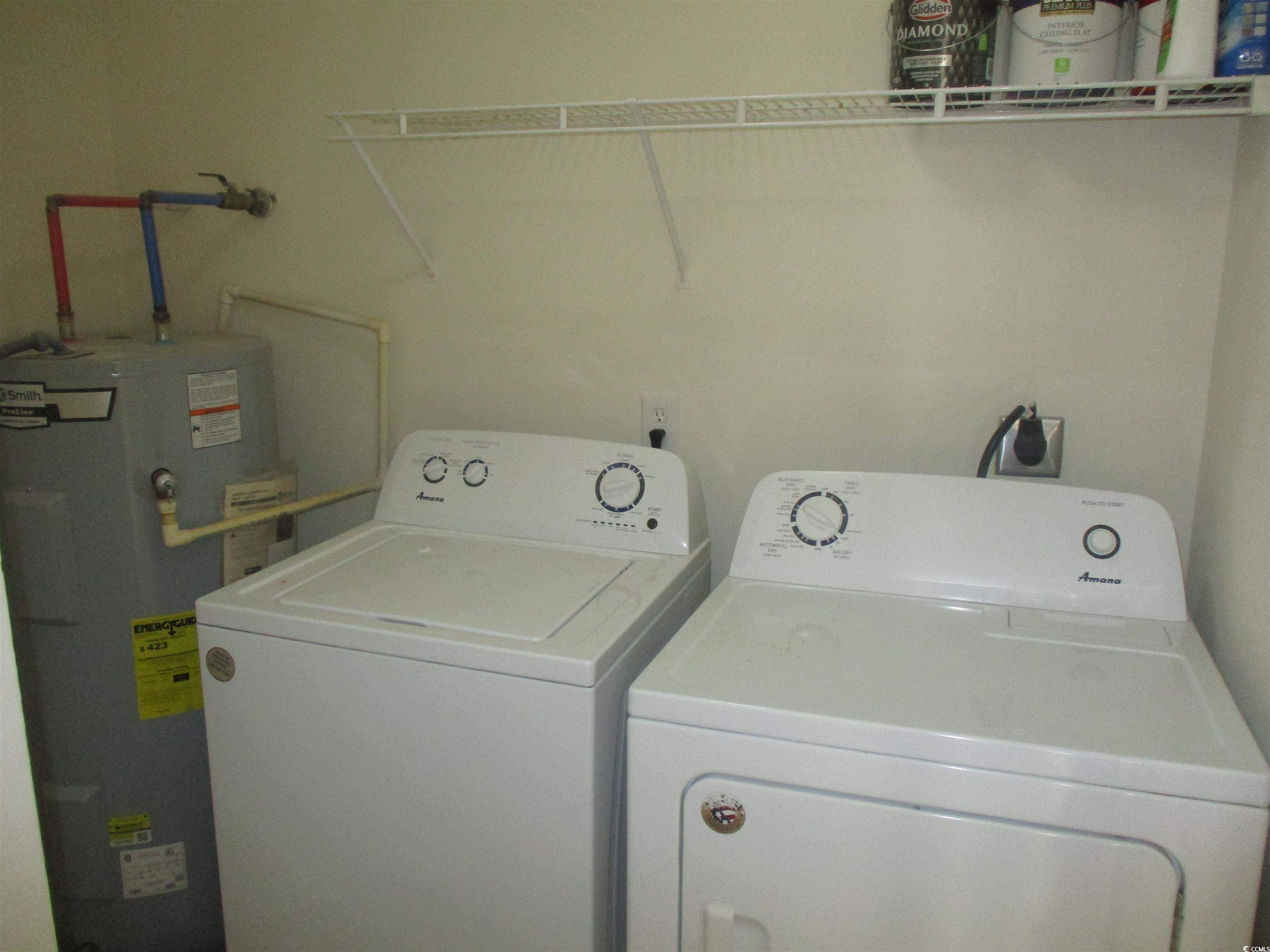8545 Hopkins Circle Surfside Beach, SC 29575 - Photo 12 of 24 Laundry area with electric water heater and washing machine and clothes dryer