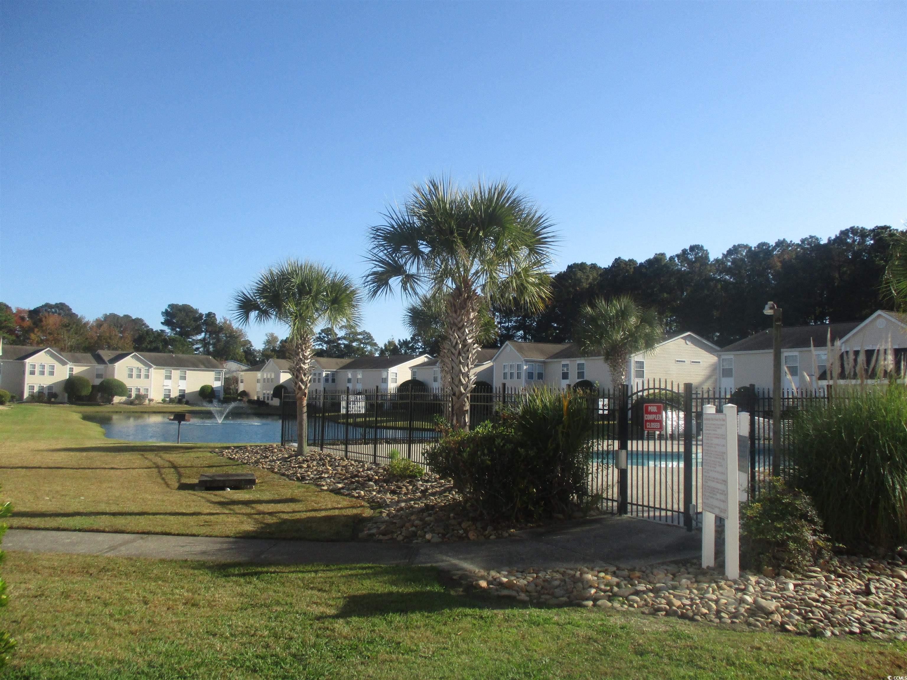 8545 Hopkins Circle Surfside Beach, SC 29575 - Photo 2 of 24 View of community featuring a residential view and a water view