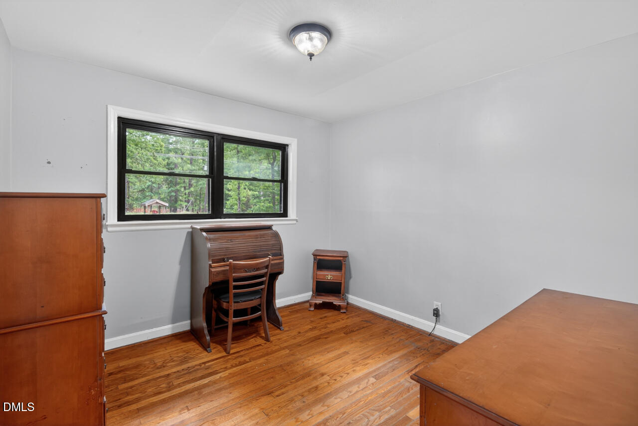 1420 Goodwin Road Durham, NC 27712 - Photo 30 of 54 a room with furniture and a window