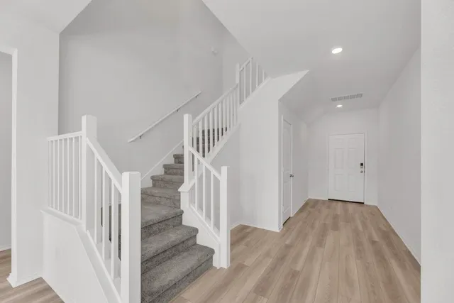 a view of entryway with wooden floor