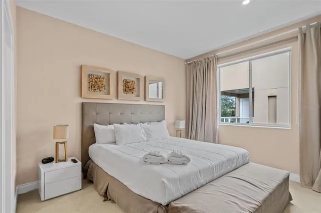 a bedroom with a bed and a couch