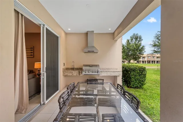 a very nice looking room with a large window and chairs
