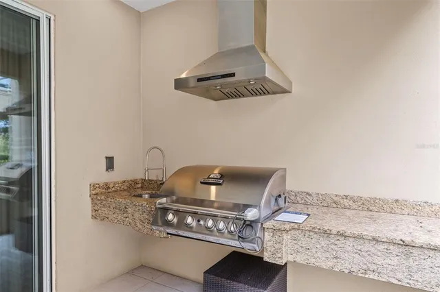 a kitchen with a stove and a refrigerator