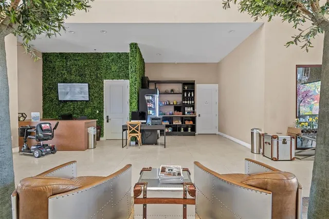 a room with gym equipment and large windows