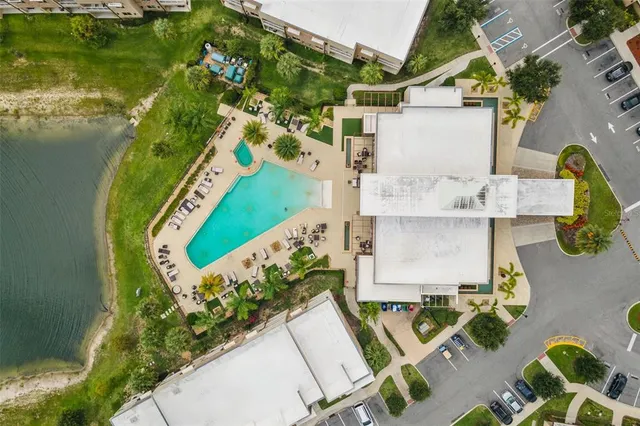 an aerial view of a residential houses with yard
