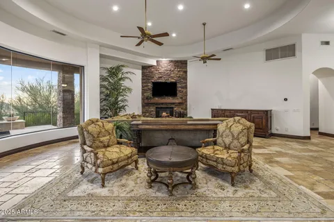 a bathroom with a granite countertop sink a toilet and a mirror