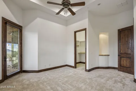 a bathroom with a granite countertop sink mirror and a bathtub