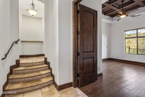 a view of a patio with couches table and chairs with wooden floor