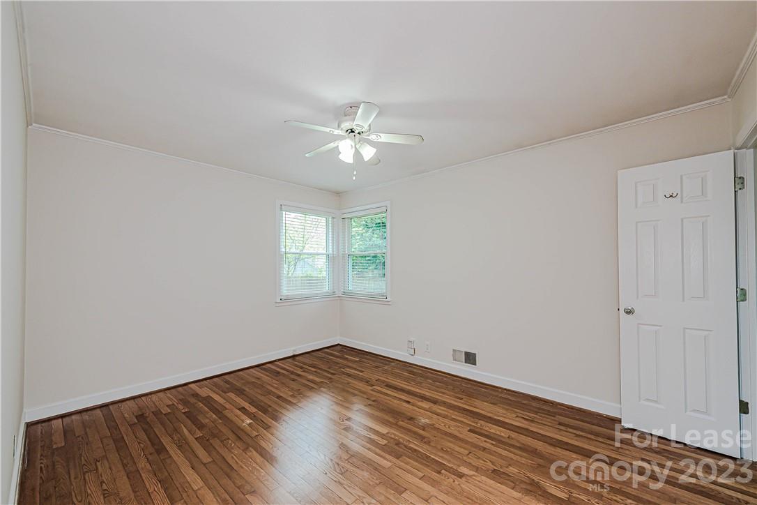 4301 Applegate Road Charlotte, NC 28209 - Photo 12 of 21 a view of a room with wooden floor and a ceiling fan