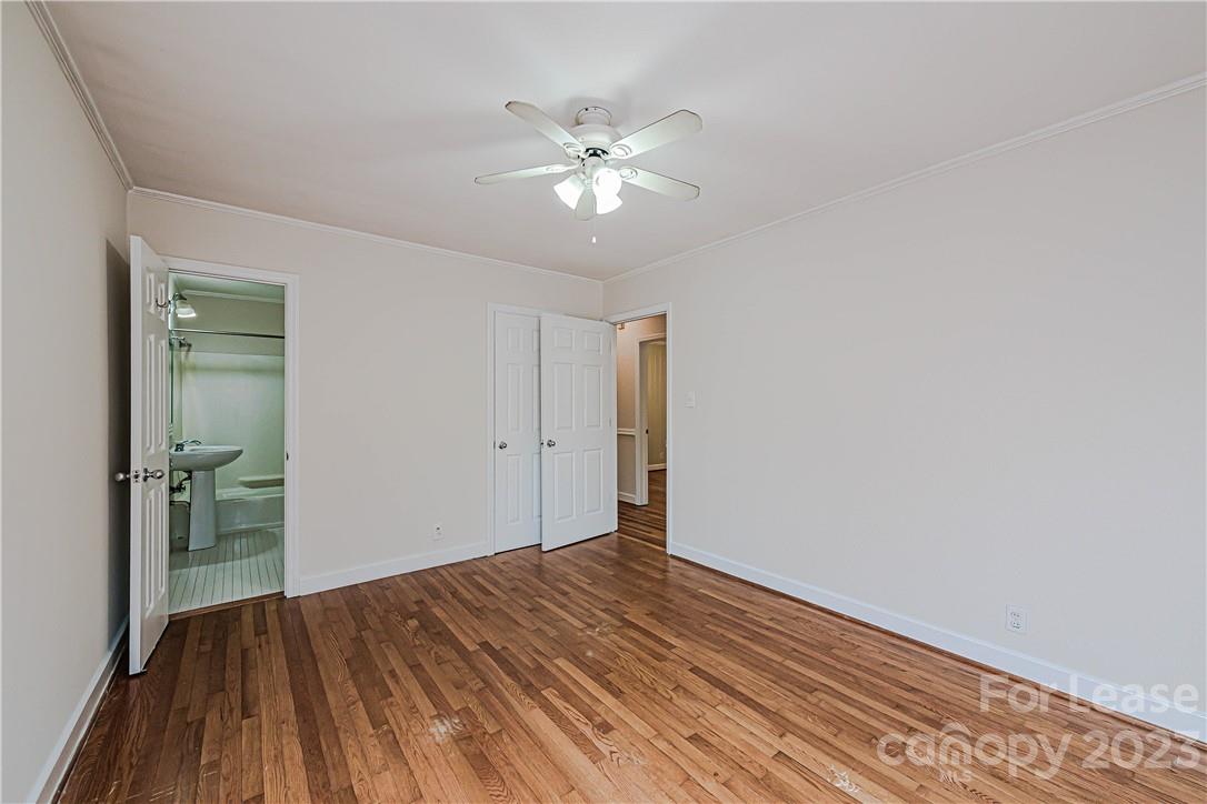 4301 Applegate Road Charlotte, NC 28209 - Photo 13 of 21 a view of a livingroom with a ceiling fan and wooden floor