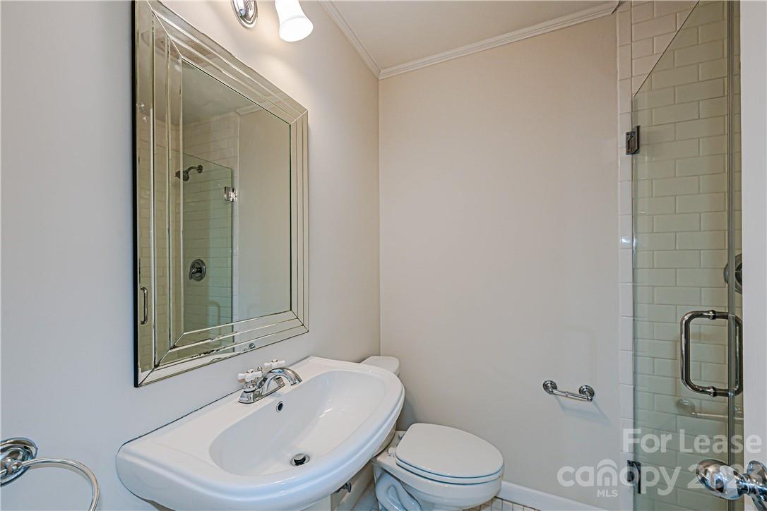 4301 Applegate Road Charlotte, NC 28209 - Photo 16 of 21 a bathroom with a sink a toilet and shower