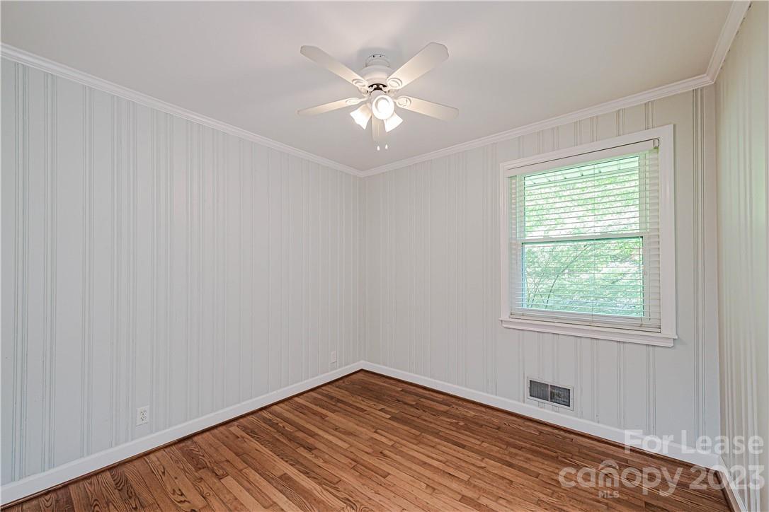4301 Applegate Road Charlotte, NC 28209 - Photo 17 of 21 a view of an empty room with wooden floor and a window