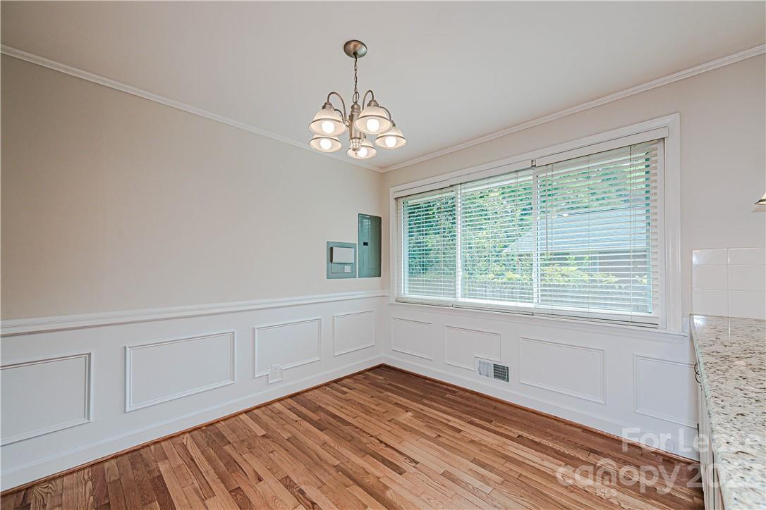 4301 Applegate Road Charlotte, NC 28209 - Photo 10 of 21 a view of empty room with wooden floor and fan