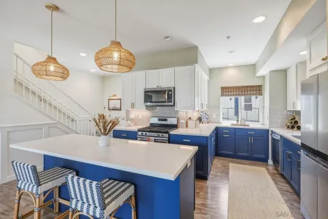 a kitchen with a sink and cabinets