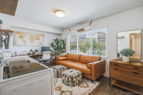 a workspace with furniture and a potted plant