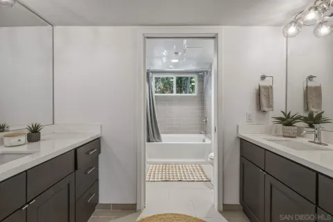 a bathroom with a bathtub and a shower