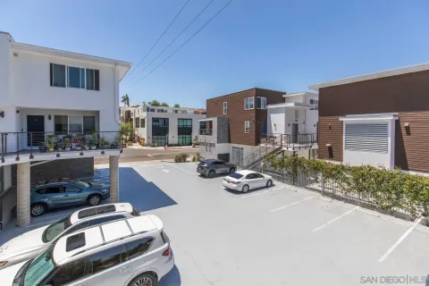 a view of parking garage with cars parked