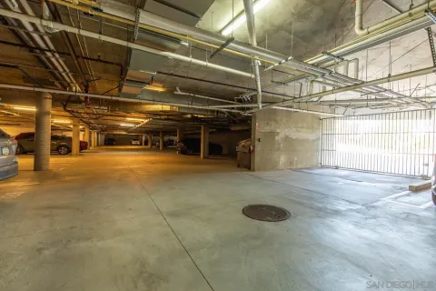 a view of parking garage with cars