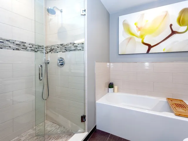 a bathroom with a tub and shower
