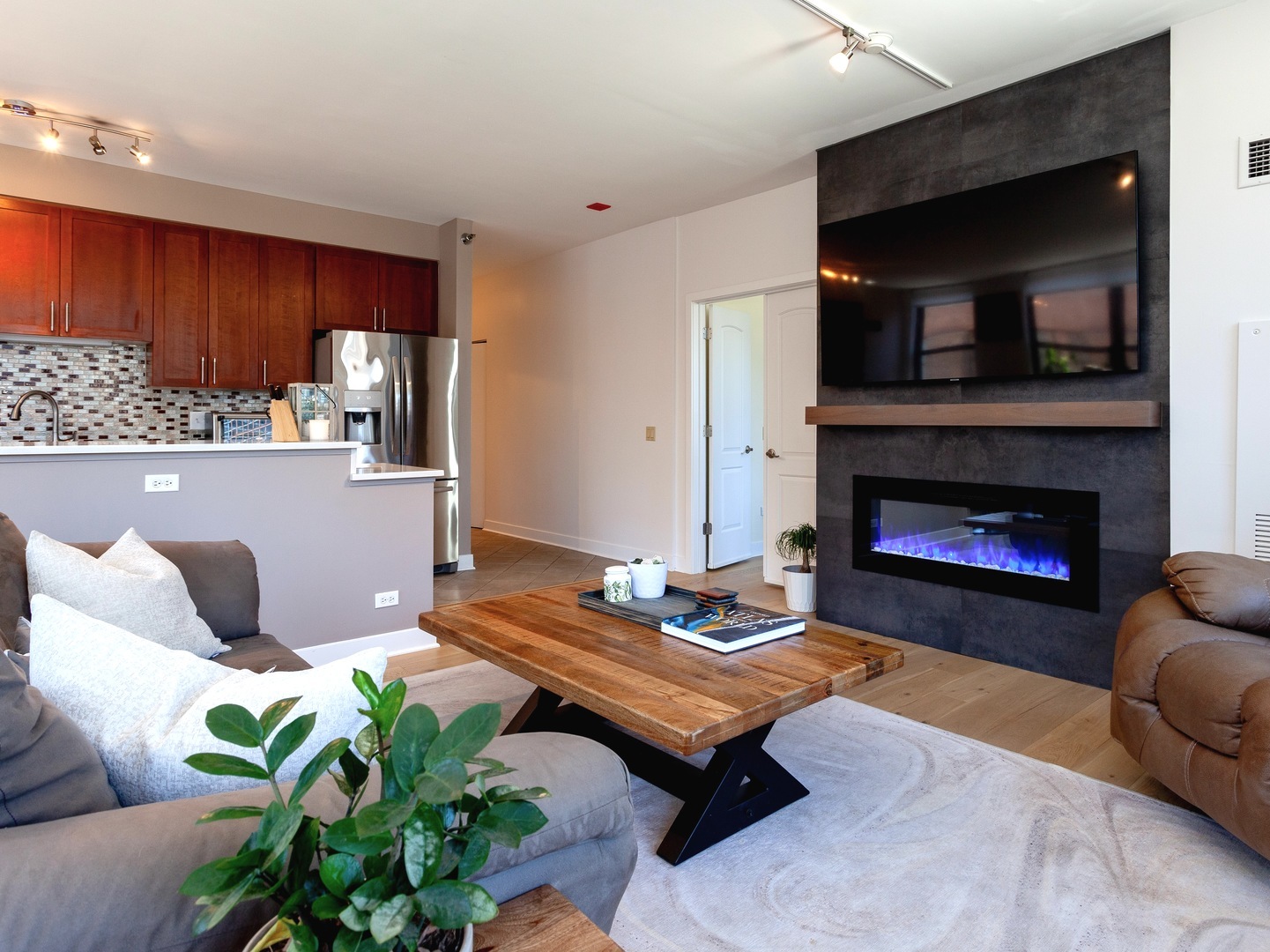330 North Jefferson Street, Unit 904 Chicago, IL 60661 - Photo 5 of 22 a living room with furniture and a fireplace