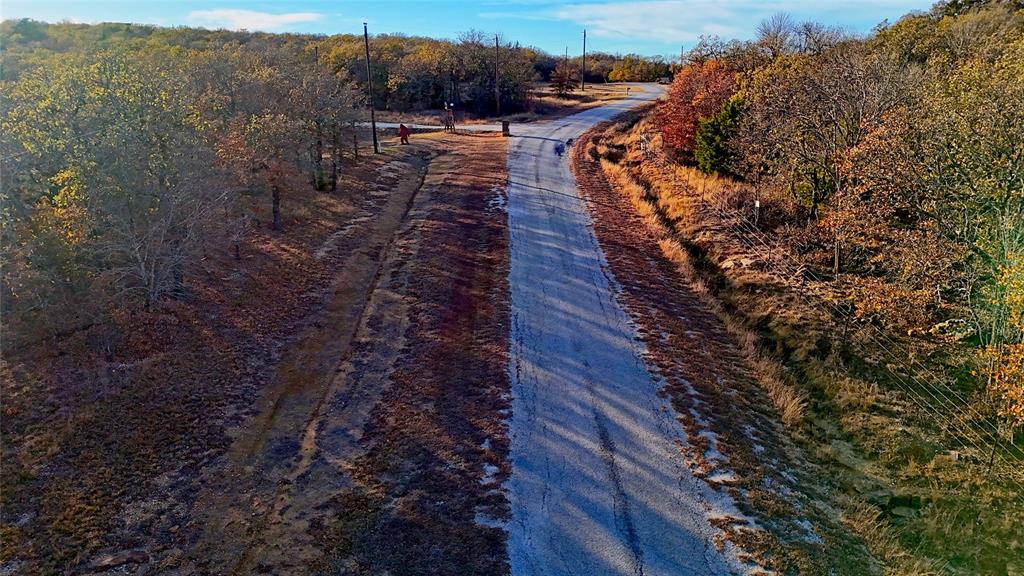 1943 Lakeridge Boulevard Sunset, TX 76270 - Photo 17 of 24 a view of a yard with wooden fence