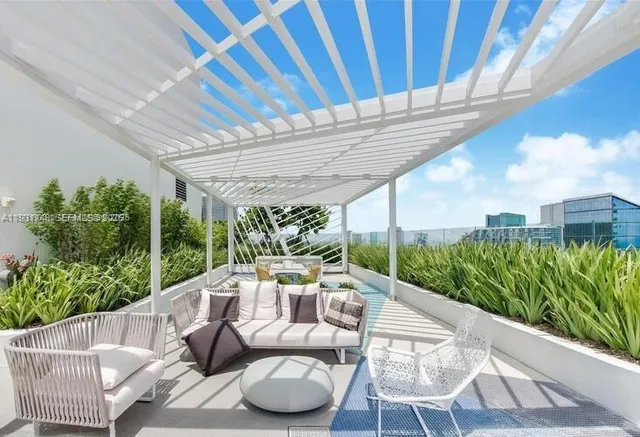 a view of a patio with furniture