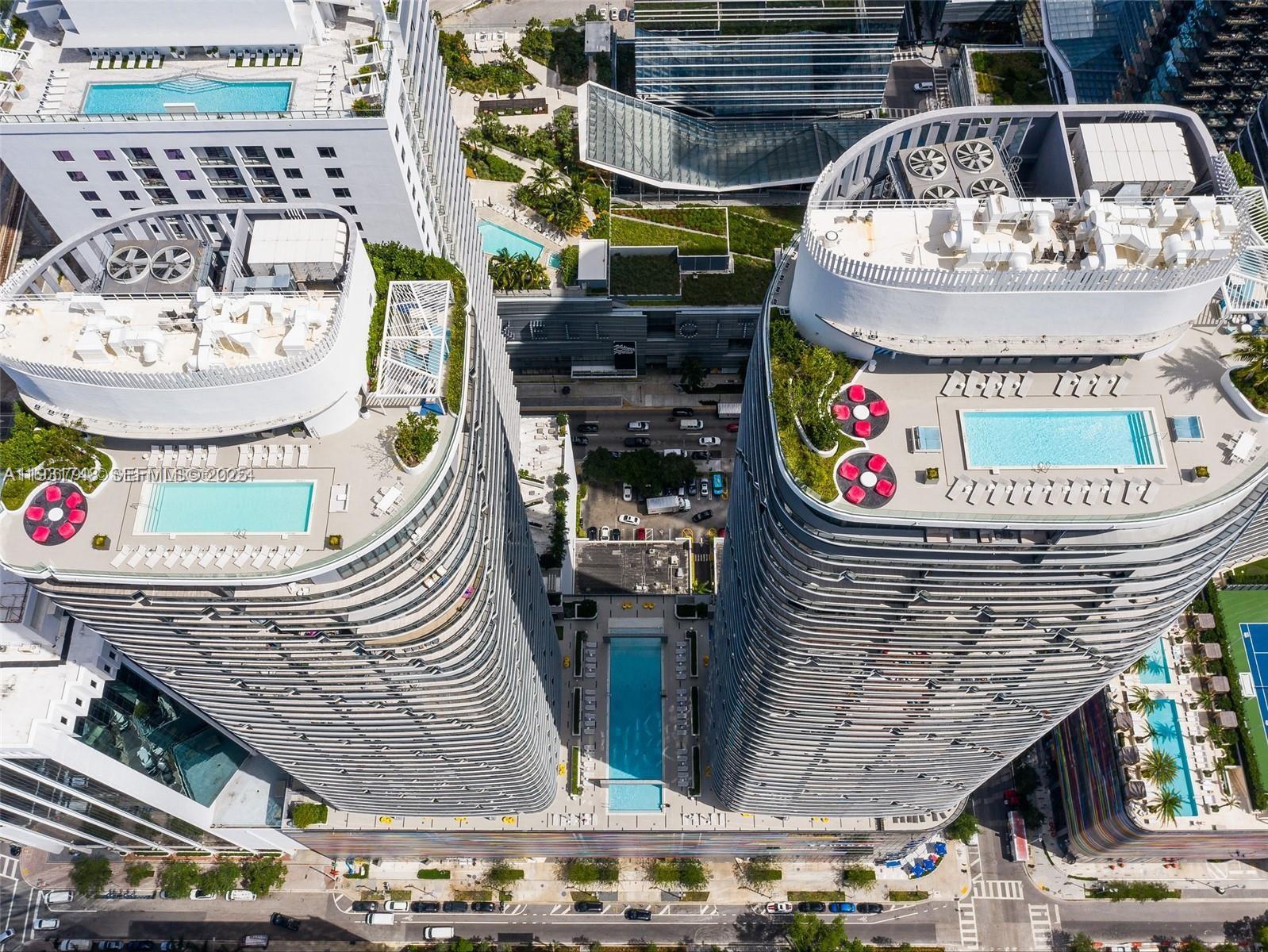 55 Southwest 9th Street, Unit 3609 Miami, FL 33130 - Photo 20 of 21 a picture of a table and chairs in the patio
