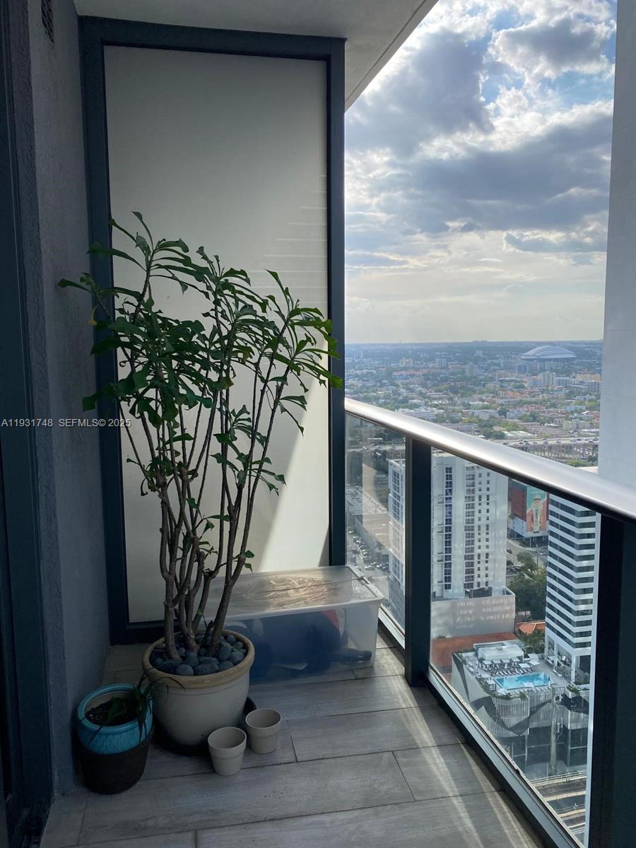55 Southwest 9th Street, Unit 3609 Miami, FL 33130 - Photo 6 of 21 a view of a porch with furniture and a potted plant