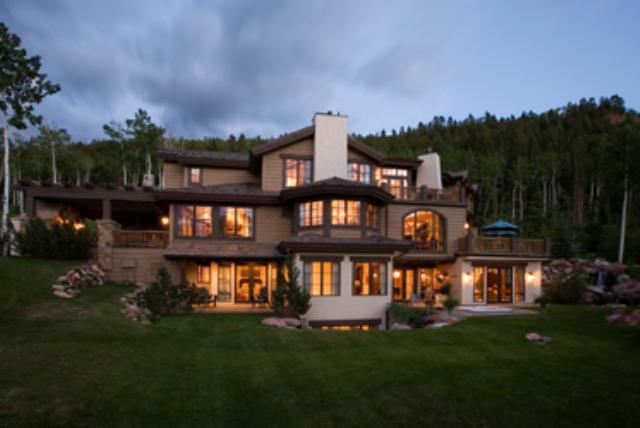 127 Powderbowl Trail Aspen, CO 81611 - Photo 1 of 9 a front view of a house with a garden