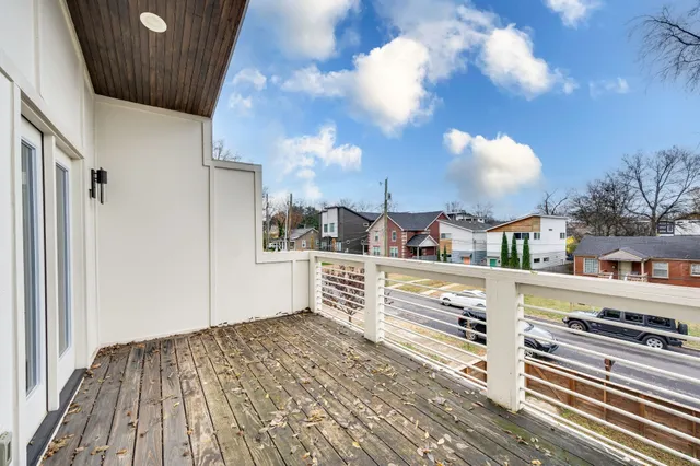 a view of kitchen with stainless steel appliances and cabinets