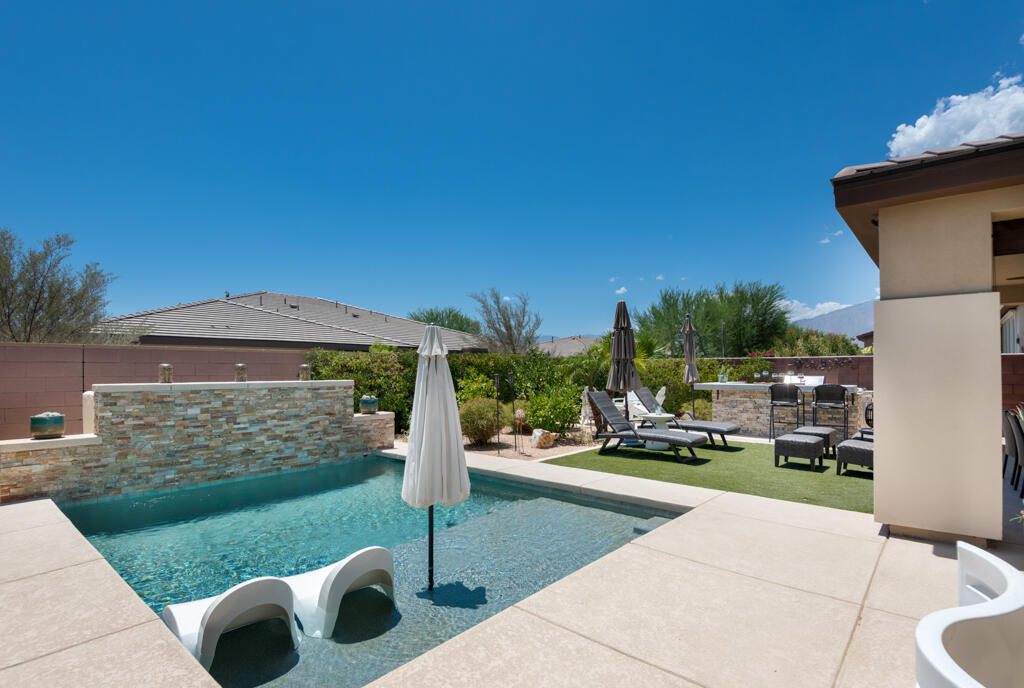82803 Spirit Mountain Drive Indio, CA 92201 - Photo 23 of 30 a front view of a house with a yard